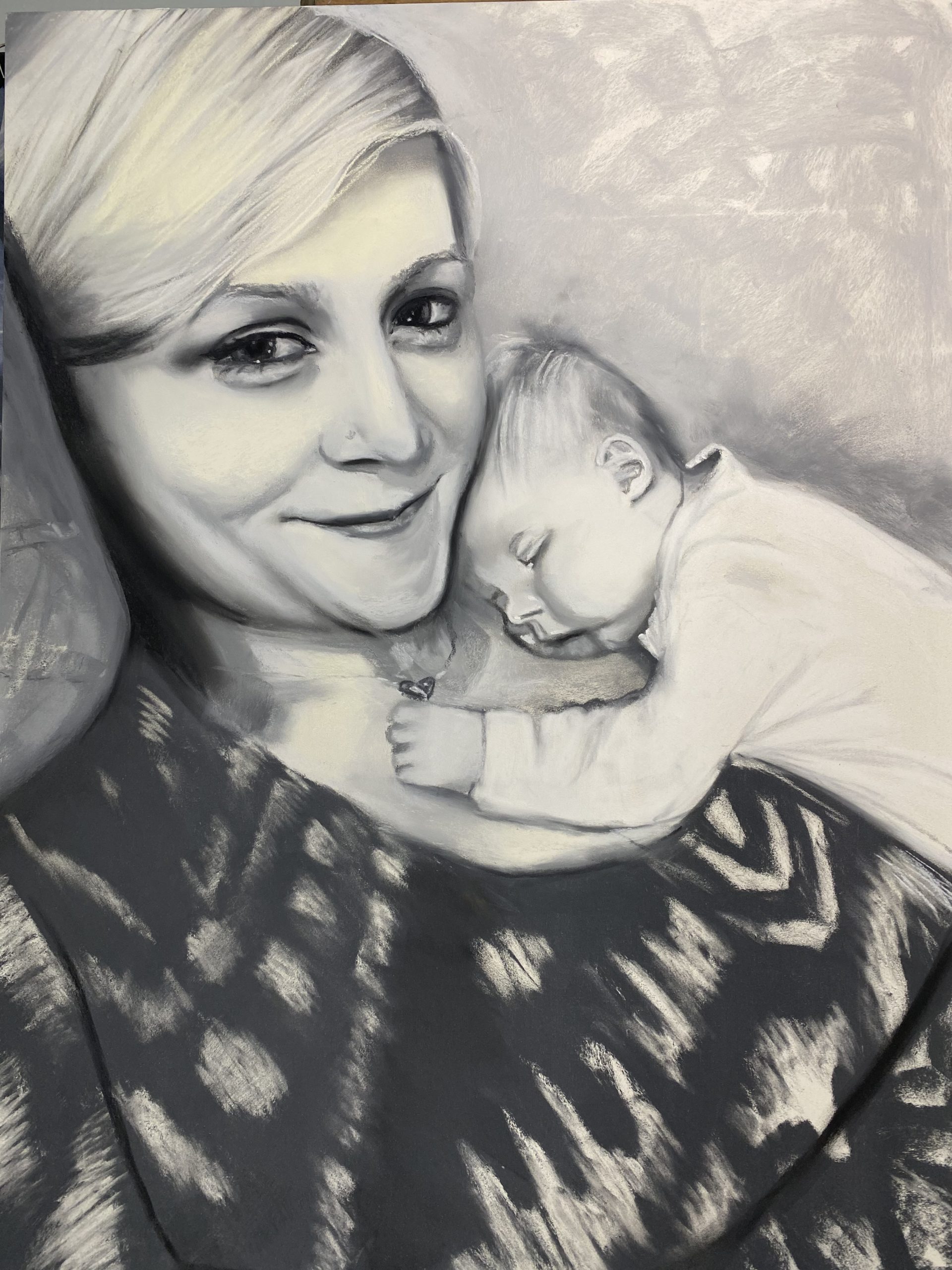 Charcoal drawing of mother and child