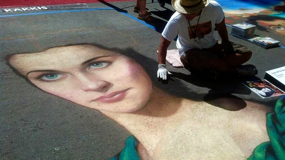 Painting street art - chalk portraits