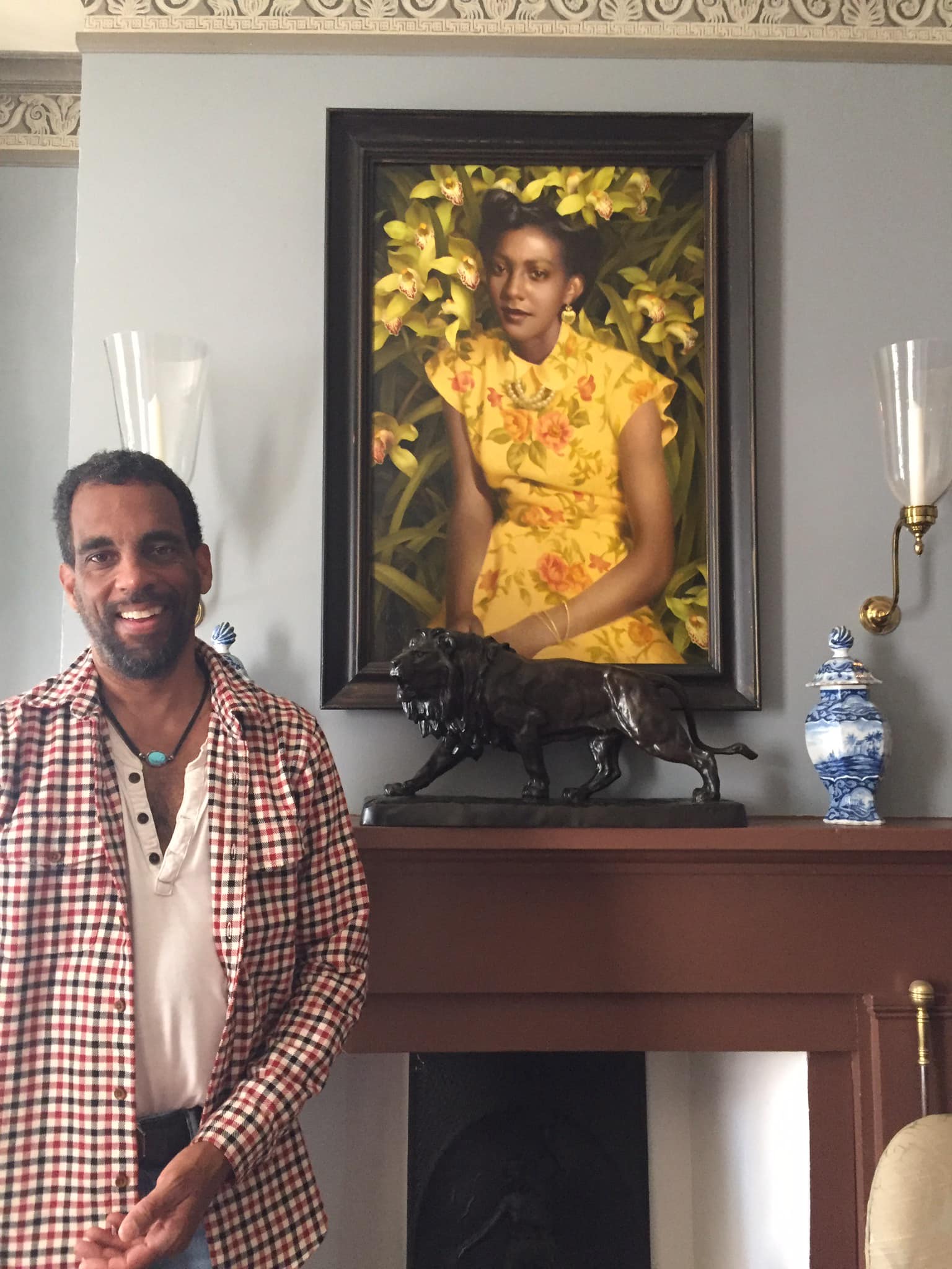 Timmie with “Wild Orchid,” a shrine to his mother, in his home.