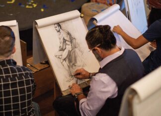 As he works on a figure drawing demonstration piece, Jeffrey Watts wields the long, needle-sharp pencil leads that are characteristic of classical training.