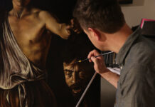 Jeremy Caniglia at his easel, painting a master copy of “David with the Head of Goliath”