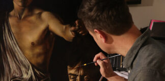 Jeremy Caniglia at his easel, painting a master copy of “David with the Head of Goliath”