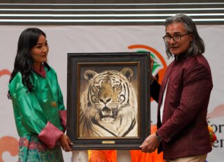 Wildlife Painting Presented to Queen of Bhutan John Banovich presenting his painting, "Tak" as a gift to Her Majesty, the Queen of Bhutan, at the Sustainable Finance for Tiger Landscapes Conference in Bhutan, April, 2024