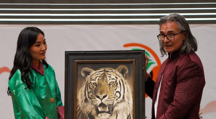 Wildlife Painting Presented to Queen of Bhutan John Banovich presenting his painting, "Tak" as a gift to Her Majesty, the Queen of Bhutan, at the Sustainable Finance for Tiger Landscapes Conference in Bhutan, April, 2024