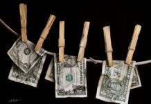 Lynn Pratt, "Money Laundering," watercolor, 21 x 15 in.; painting of money hanging from clothespins